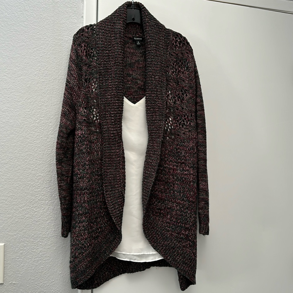 Purple, pink and forest green knitted cocoon sweater from Torrid.